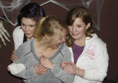 Photograph of three scared girls at Milburn Manor