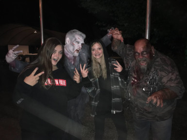 Photograph of a group of 4 guests and monsters at Milburn Manor