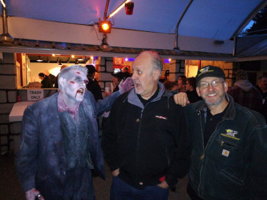 Photograph of a monster character and two guests at Milburn Manor